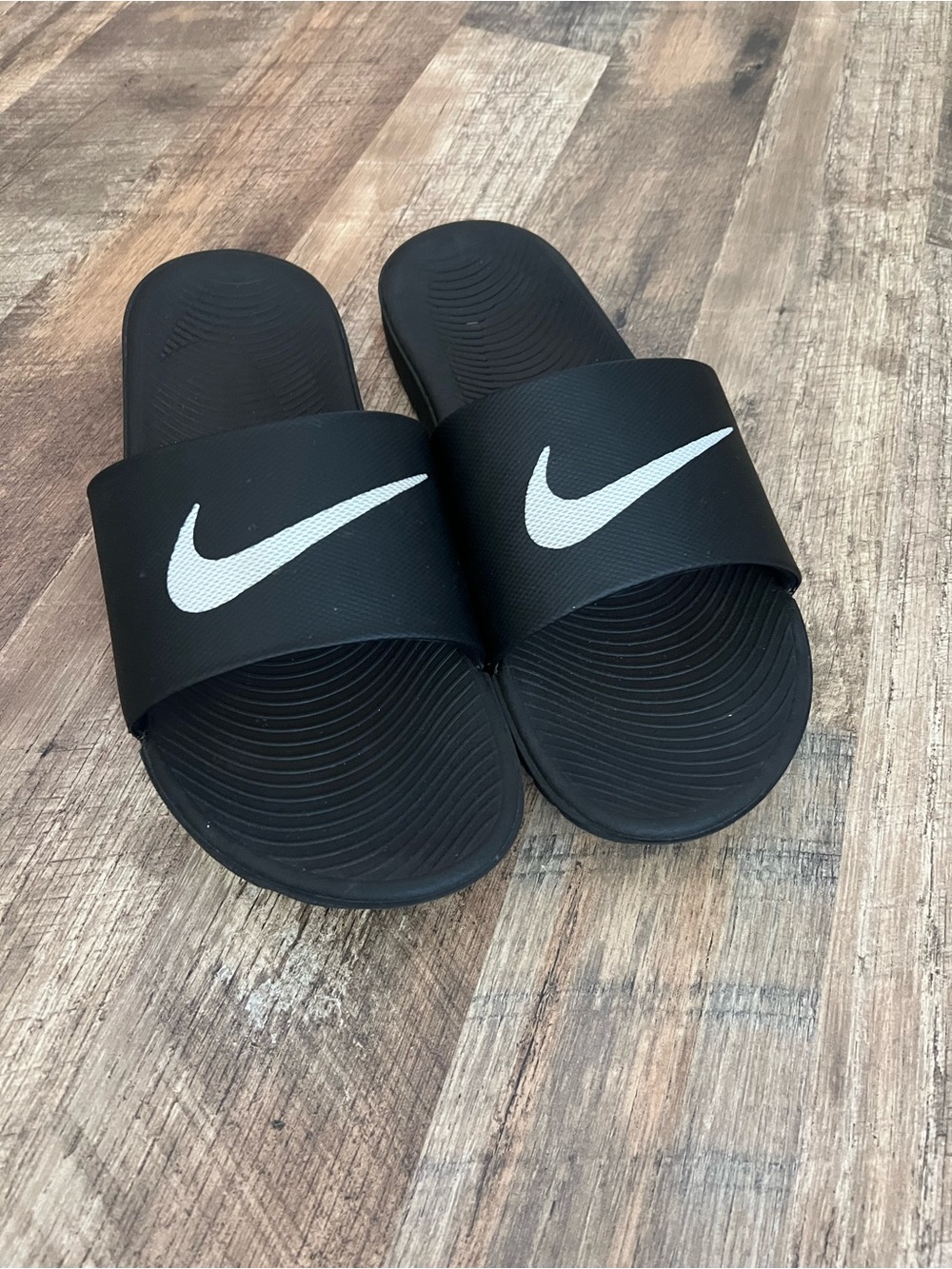 Nike Black Slides with White Swoosh Logo
